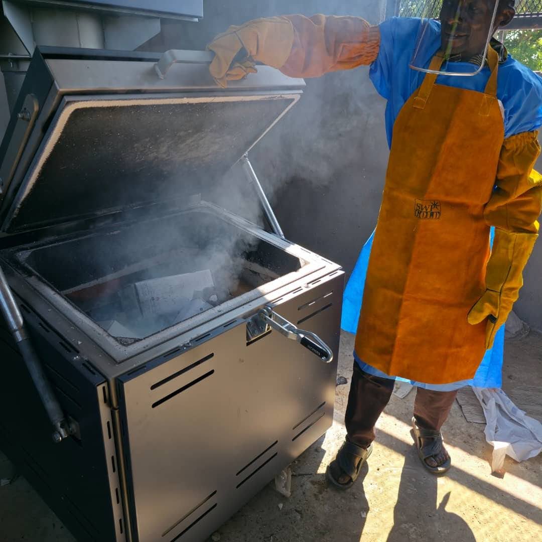 Installation and demonstration of incinerator equipment at a Zambia health facility